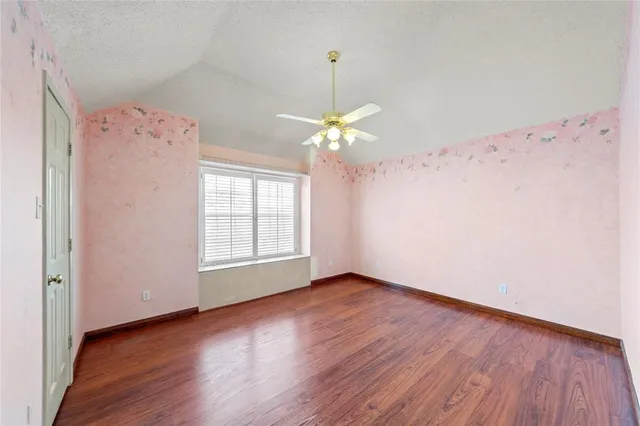 a kitchen with a sink dishwasher a stove a microwave oven with a dining table and chairs