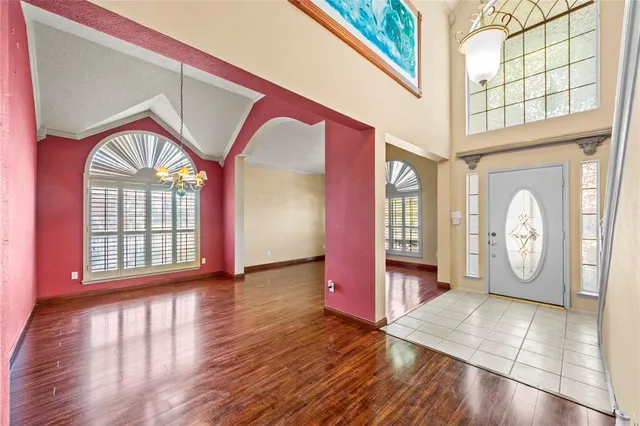 a view of an entryway with wooden floor