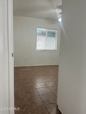a view of an empty room with a window