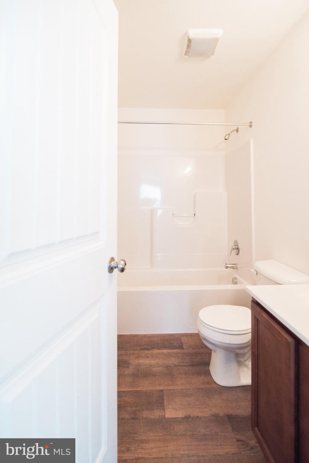 111 Deatrick Drive Gettysburg, PA 17325 - Photo 6 of 9 a bathroom with a white toilet and a shower