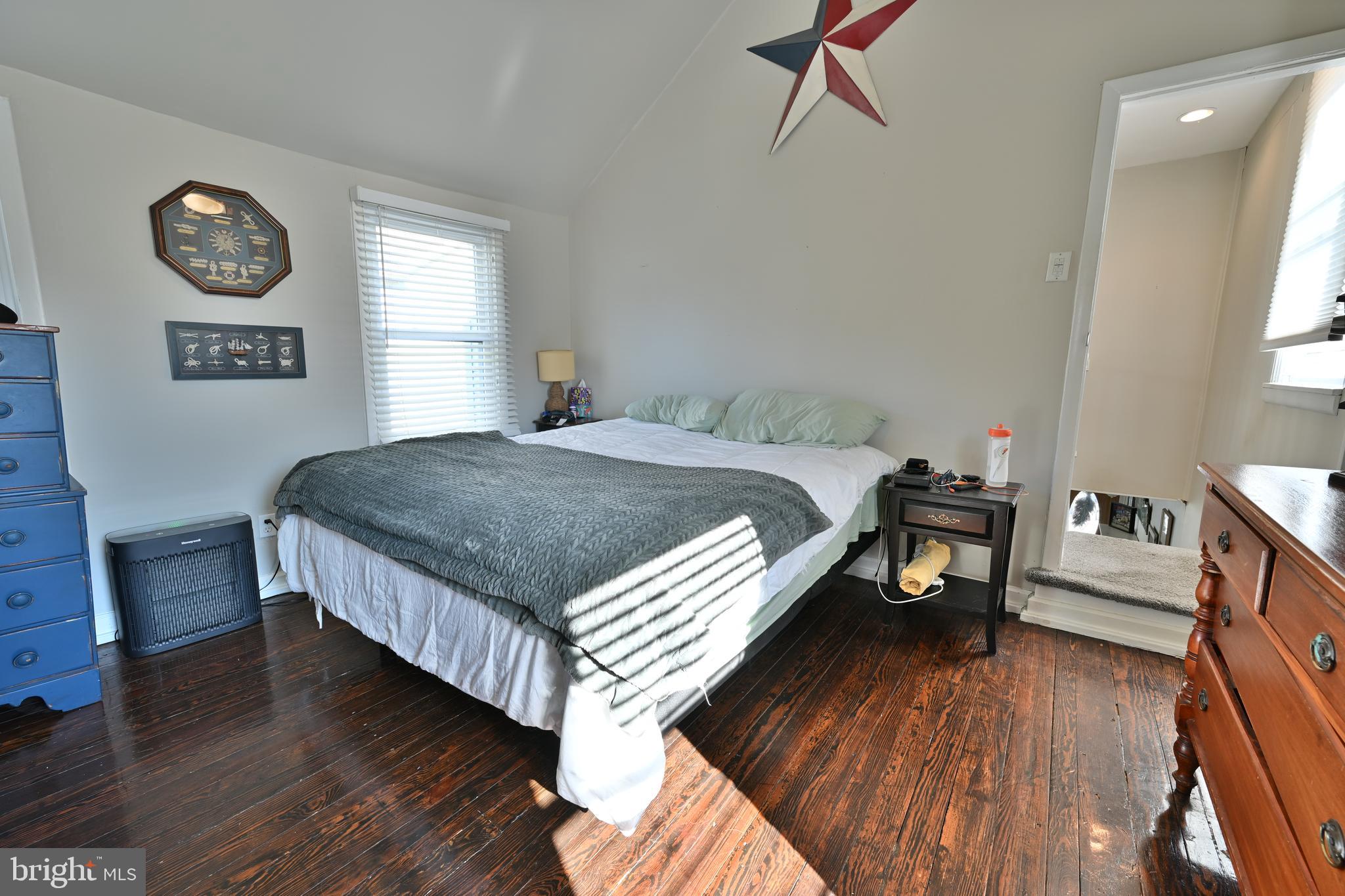24734 East Main Street Columbus, NJ 08022 - Photo 13 of 24 a bed sitting in a bedroom next to a window