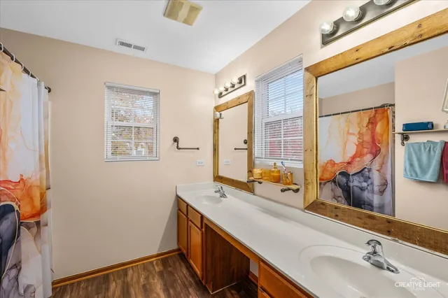 a view of walk in closet with clothes