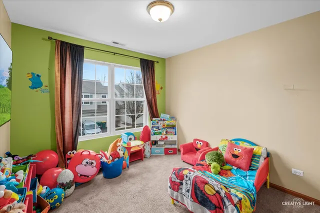 a bathroom with a sink a toilet and shower curtain
