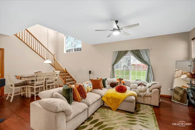 a view of a dining room with furniture and a potted plant