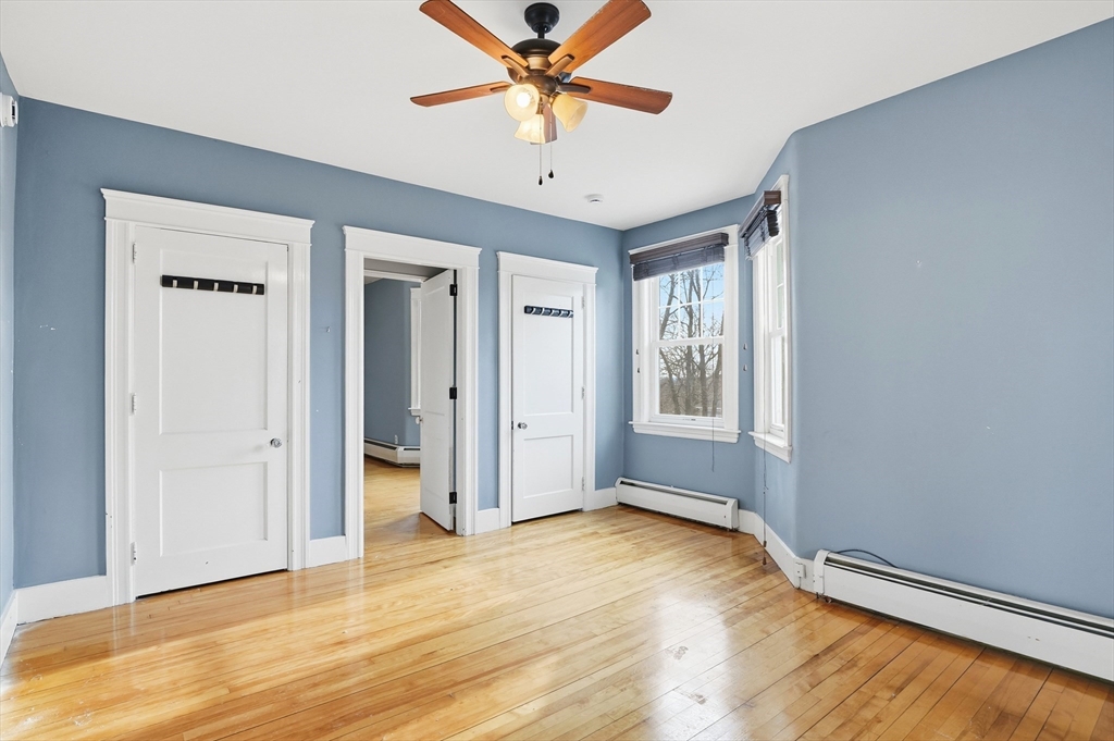 7 Columbine Road Worcester, MA 01609 - Photo 14 of 32 a view of a livingroom with a chandelier fan and windows