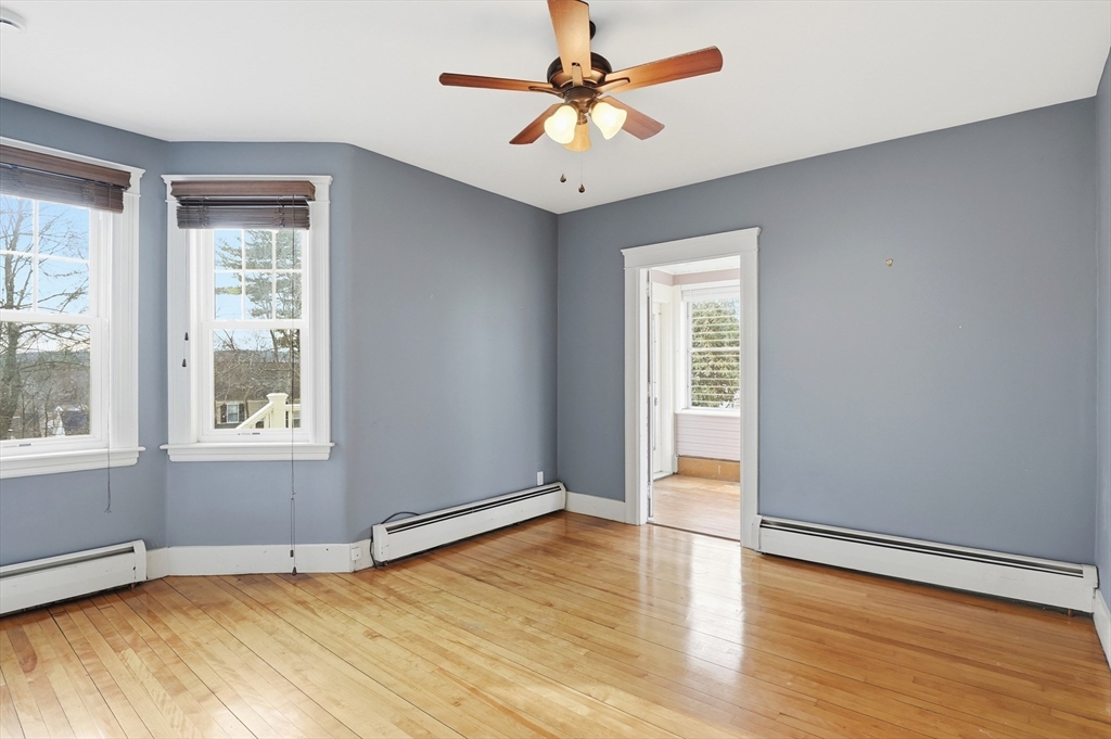 7 Columbine Road Worcester, MA 01609 - Photo 15 of 32 an empty room with wooden floor and windows