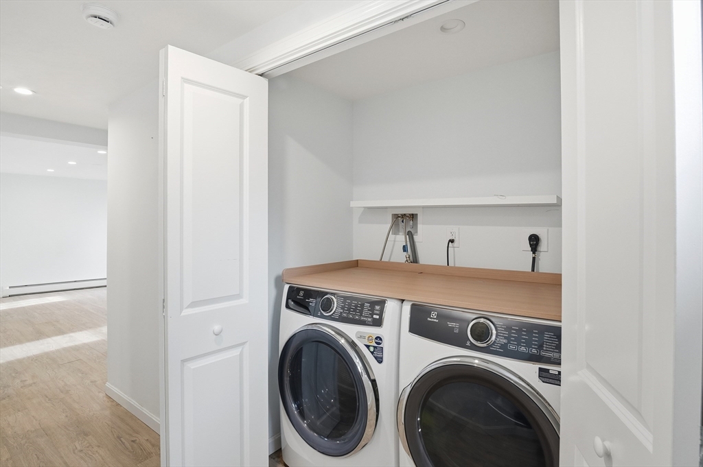 7 Columbine Road Worcester, MA 01609 - Photo 20 of 32 a view of storage and utility room with washer and dryer