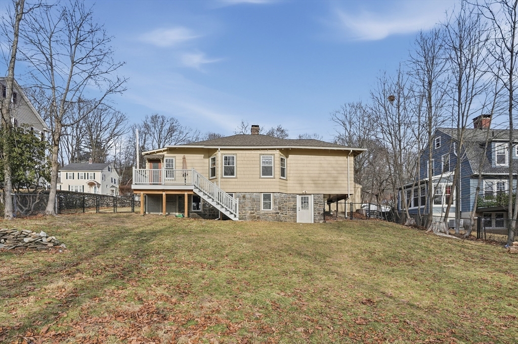 7 Columbine Road Worcester, MA 01609 - Photo 28 of 32 a view of a white house with a large yard and a yard
