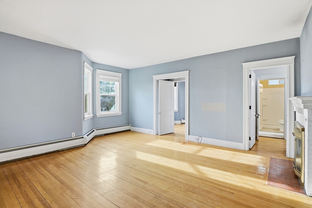 7 Columbine Road Worcester, MA 01609 - Photo 6 of 32 an empty room with wooden floor and windows