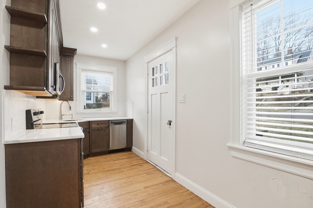 7 Columbine Road Worcester, MA 01609 - Photo 10 of 32 a large white kitchen with a sink a stove and a refrigerator