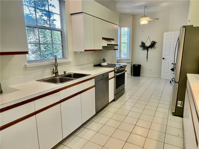 a bedroom with bed and window