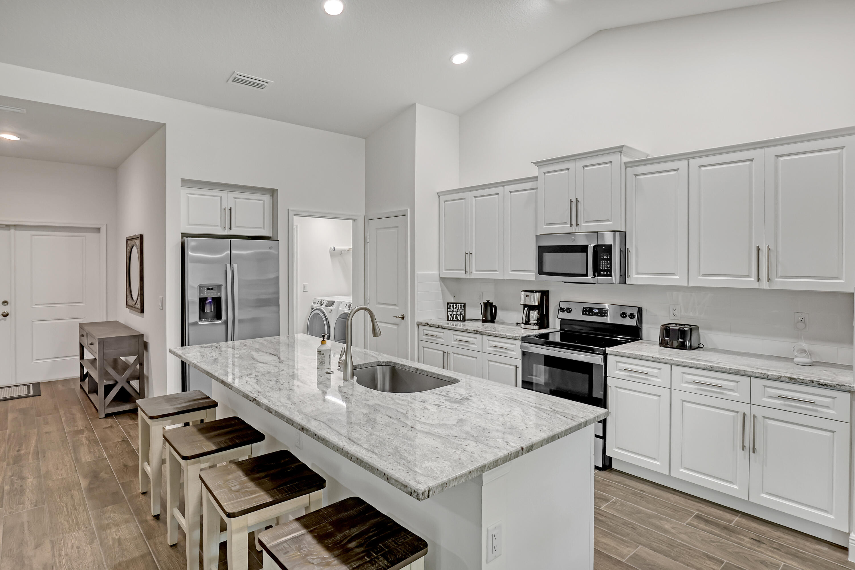 16775 Orange Boulevard Loxahatchee, FL 33470 - Photo 12 of 53 a kitchen with a sink stove and refrigerator