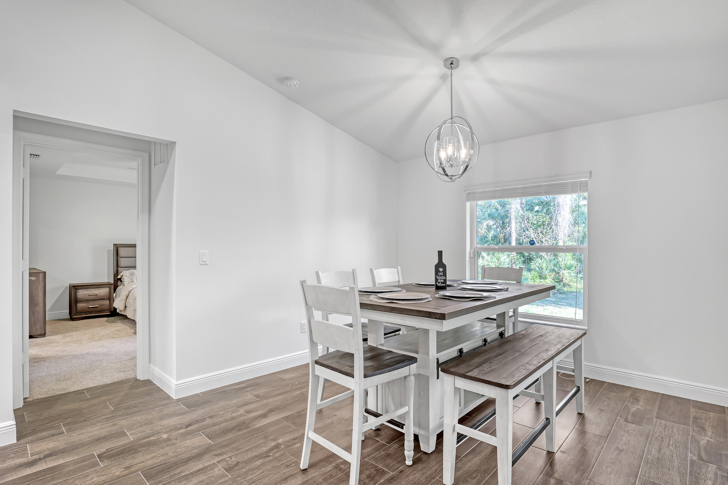 16775 Orange Boulevard Loxahatchee, FL 33470 - Photo 15 of 53 a view of a dining room with furniture window and wooden floor