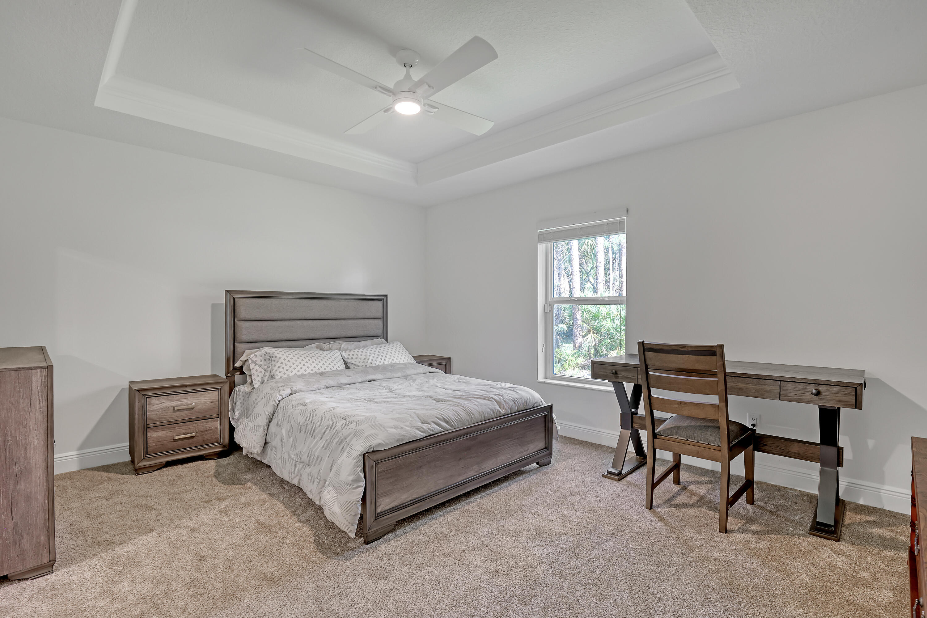 16775 Orange Boulevard Loxahatchee, FL 33470 - Photo 19 of 53 a bedroom with a bed chair and a window