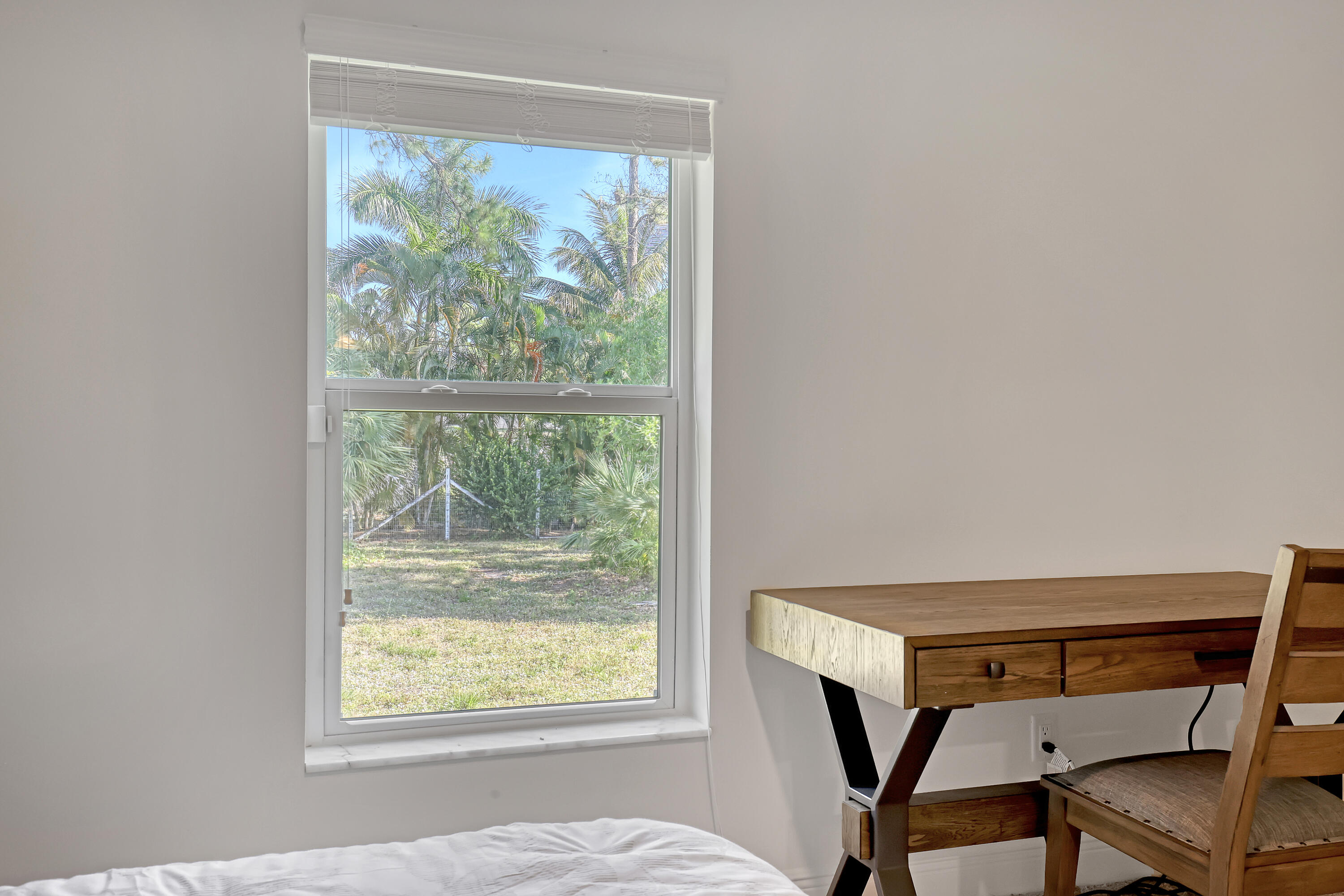 16775 Orange Boulevard Loxahatchee, FL 33470 - Photo 21 of 53 a view of a room that has a window and a table in it