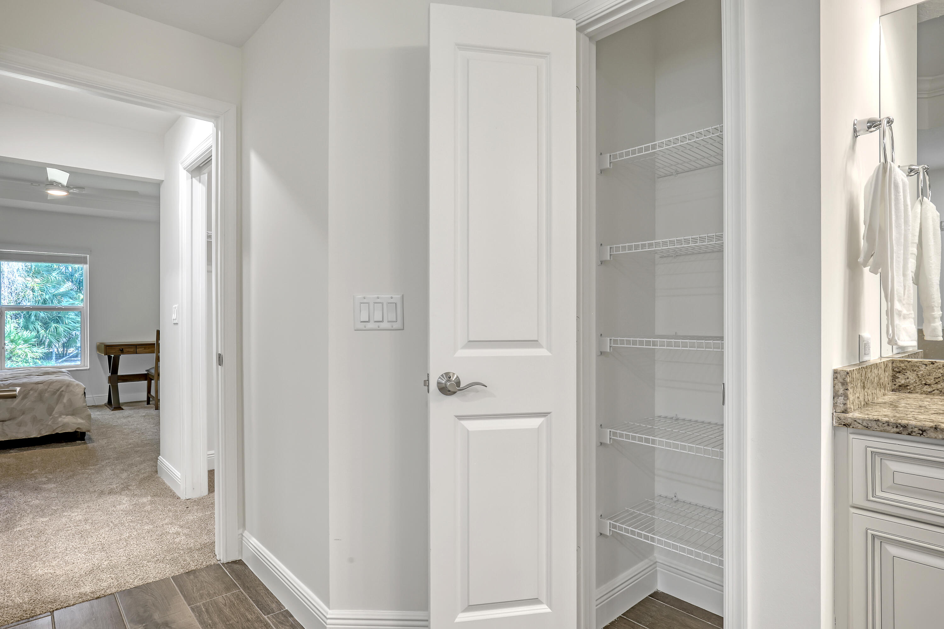 16775 Orange Boulevard Loxahatchee, FL 33470 - Photo 25 of 53 a view of a livingroom with wooden floor windows and a bedroom