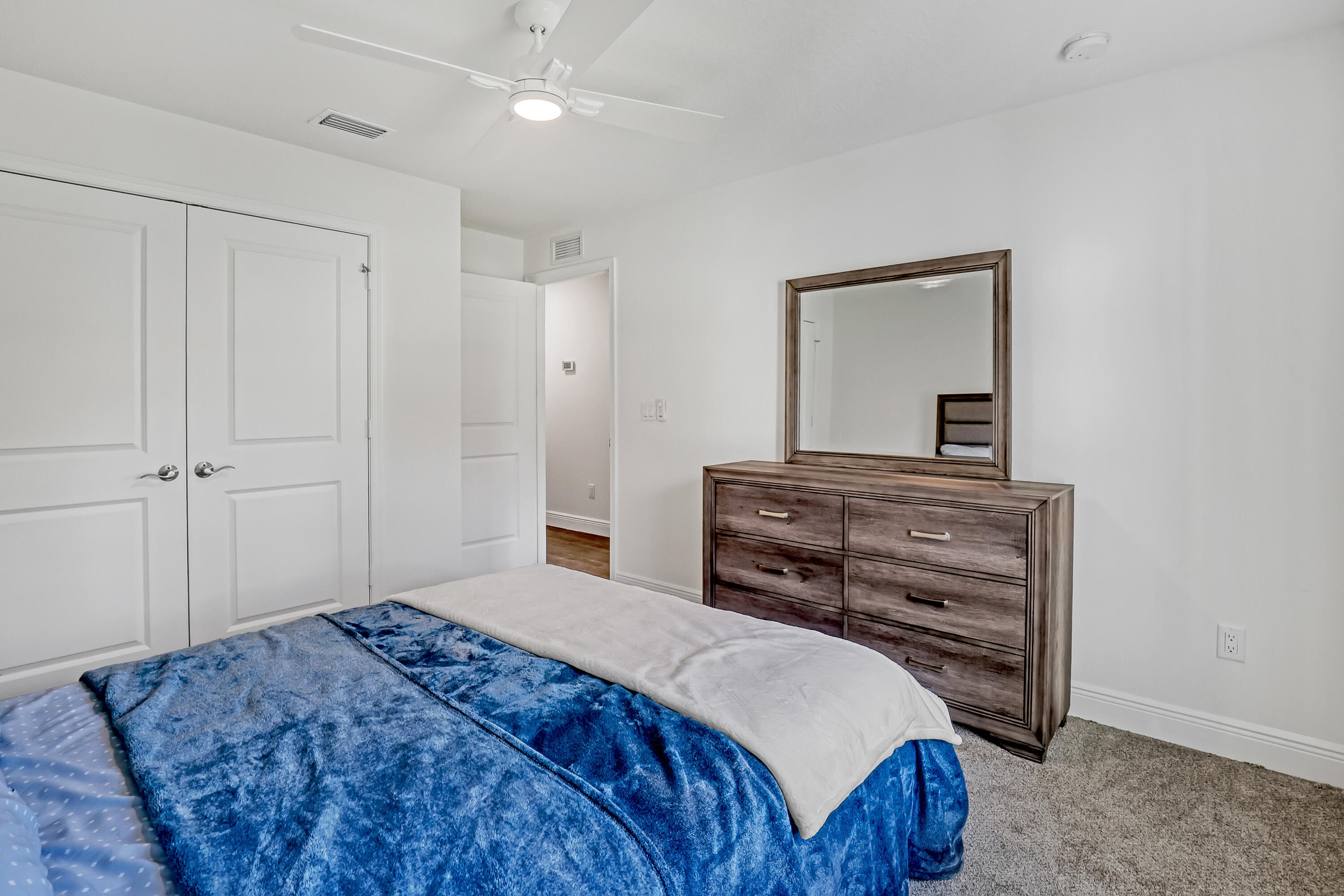 16775 Orange Boulevard Loxahatchee, FL 33470 - Photo 28 of 53 a bedroom with a bed and a dresser