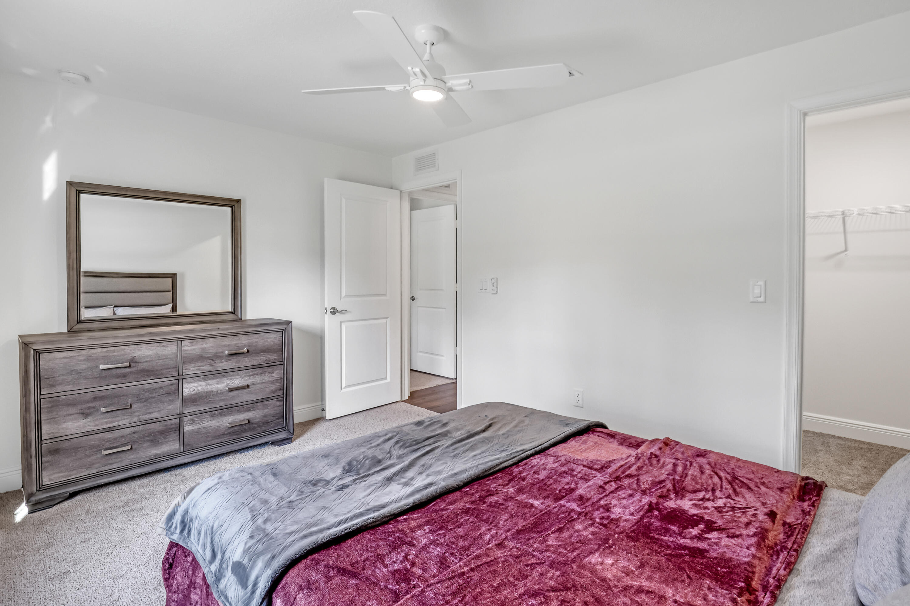 16775 Orange Boulevard Loxahatchee, FL 33470 - Photo 31 of 53 a bedroom with a bed and a dresser