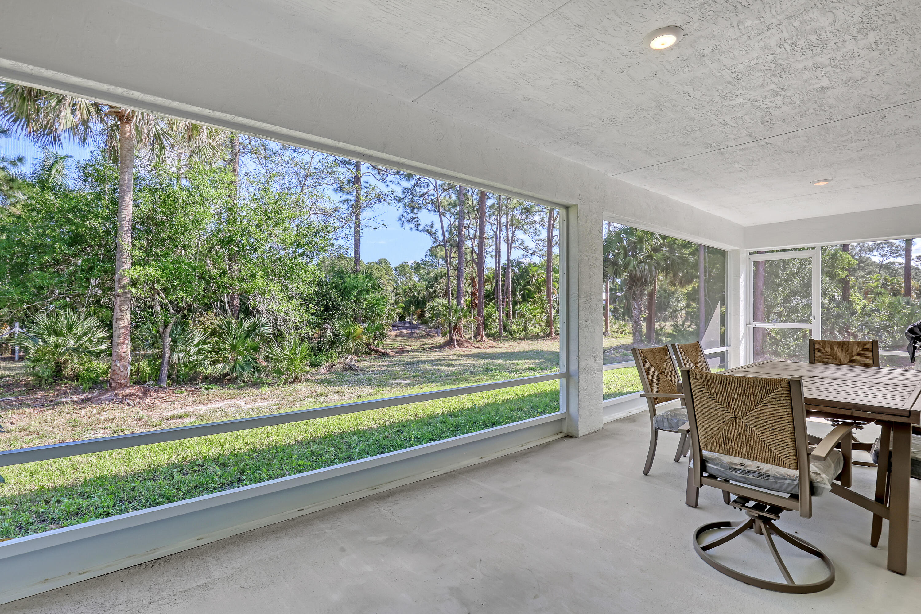 16775 Orange Boulevard Loxahatchee, FL 33470 - Photo 38 of 53 a view of a room that has a bed and a table chair