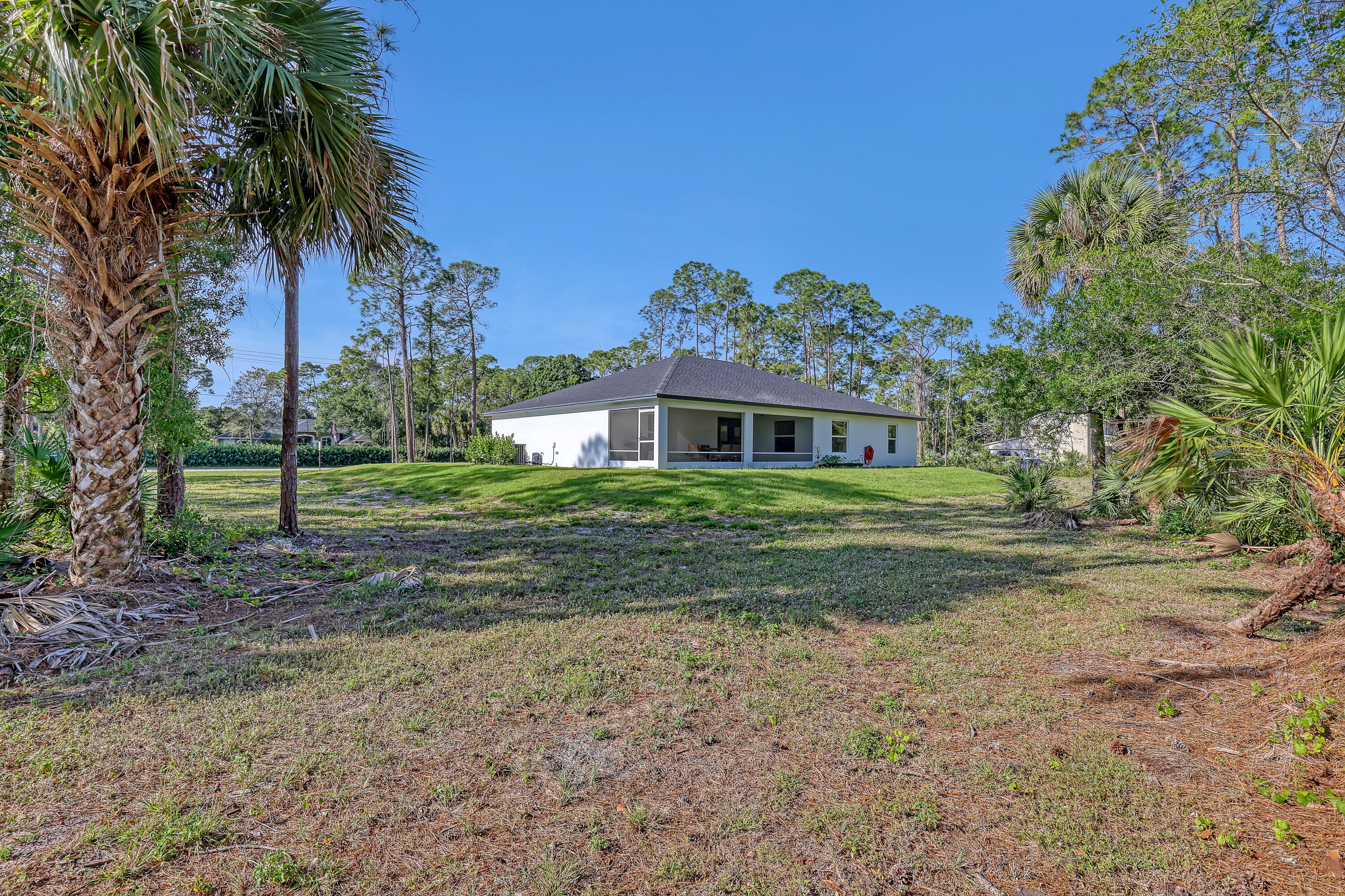 16775 Orange Boulevard Loxahatchee, FL 33470 - Photo 44 of 53 a view of a house with a yard