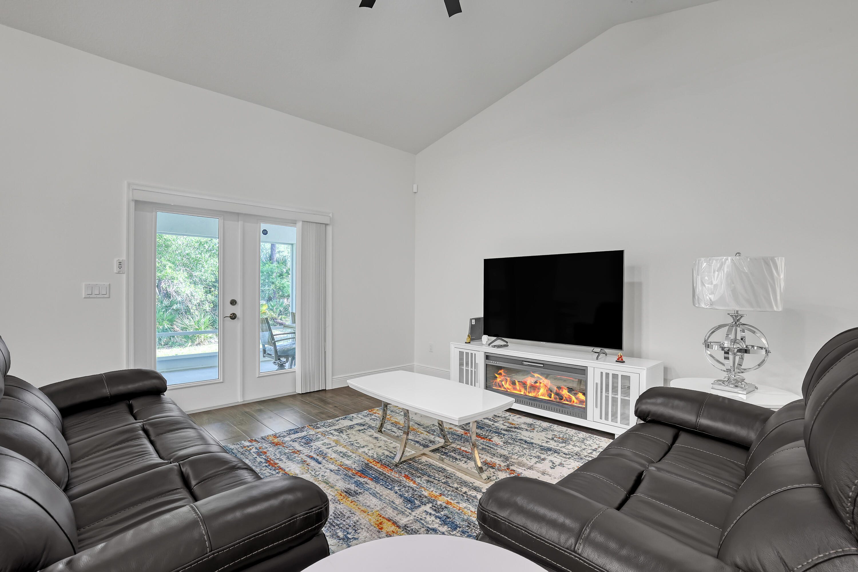 16775 Orange Boulevard Loxahatchee, FL 33470 - Photo 6 of 53 a living room with furniture and a flat screen tv