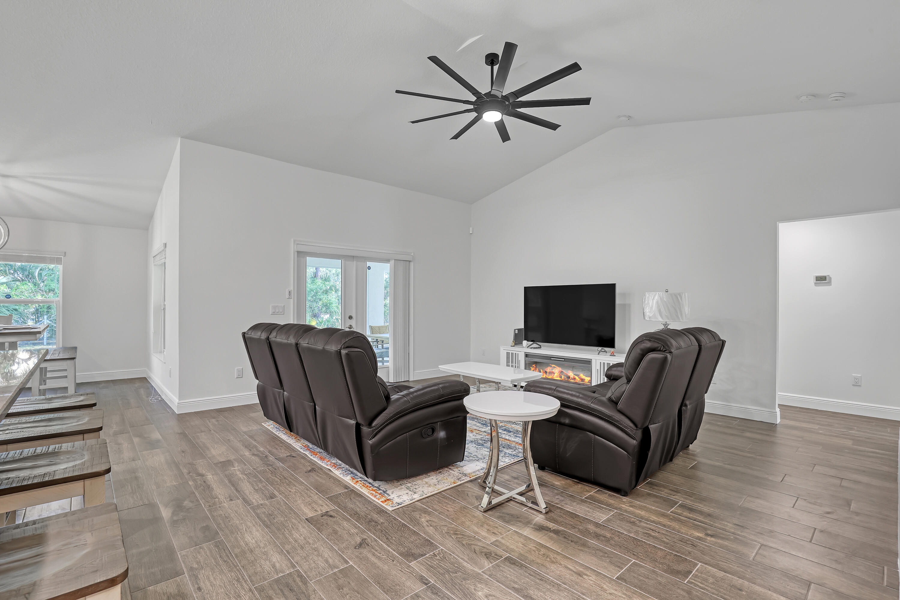 16775 Orange Boulevard Loxahatchee, FL 33470 - Photo 8 of 53 a living room with furniture and a flat screen tv