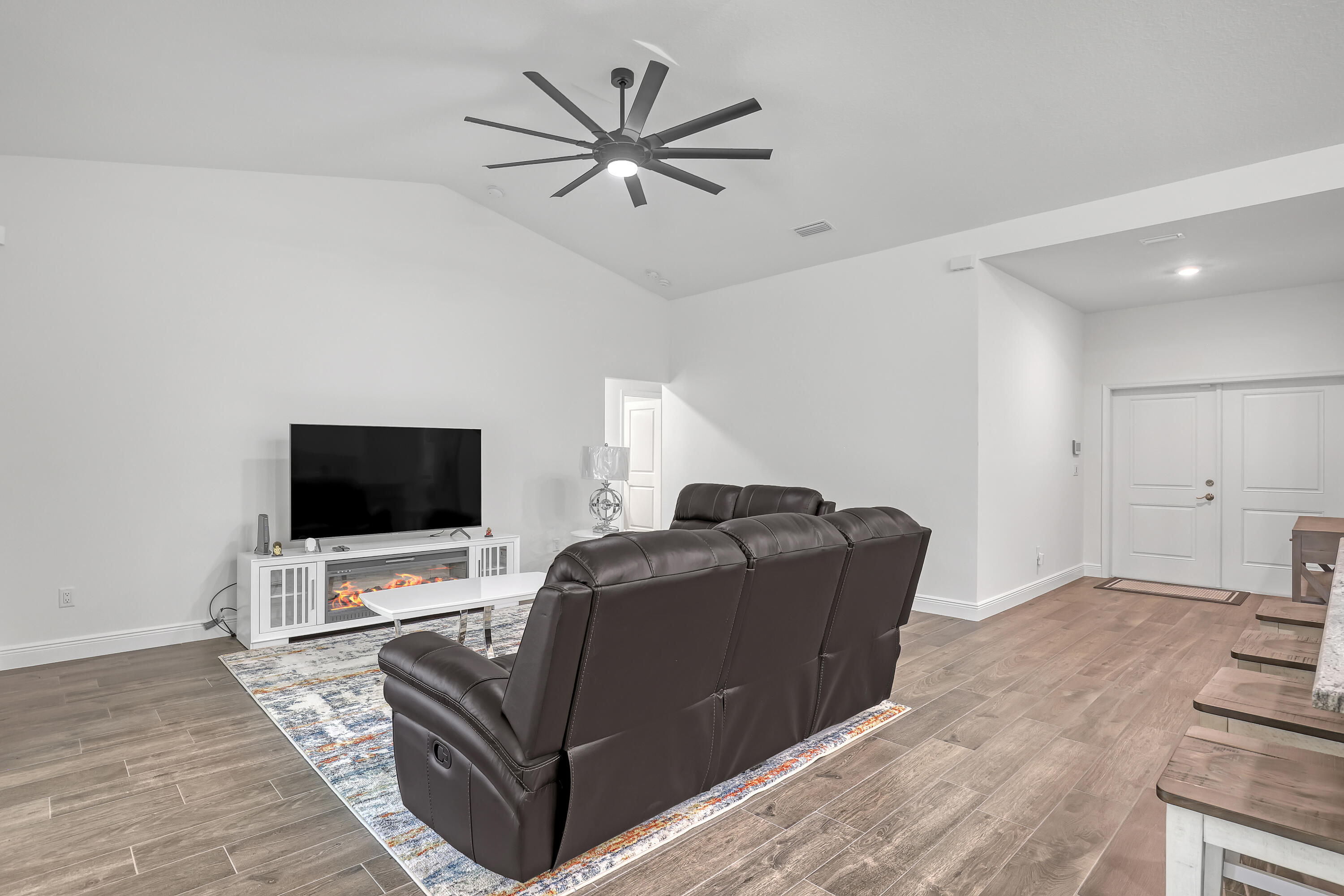 16775 Orange Boulevard Loxahatchee, FL 33470 - Photo 9 of 53 a living room with furniture and a flat screen tv