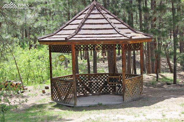 3415 Arena Road Colorado Springs, CO 80921 - Photo 33 of 36 Gazeebo with matching steel roof to house,.. note the stamped concrete.