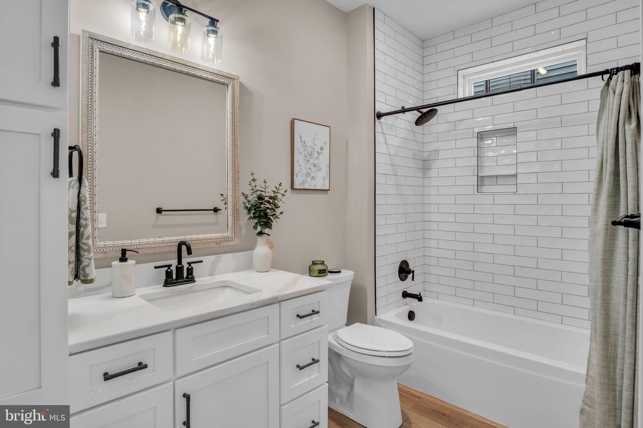 4120 Locust Road Camp Hill, PA 17011 - Photo 11 of 38 a bathroom with a sink a toilet and shower
