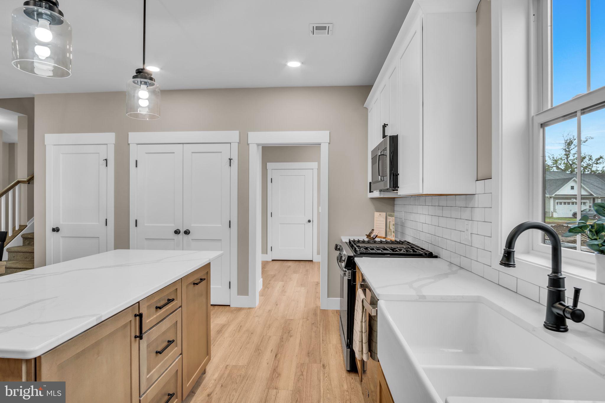 4120 Locust Road Camp Hill, PA 17011 - Photo 20 of 38 a kitchen with granite countertop a sink stove and cabinets