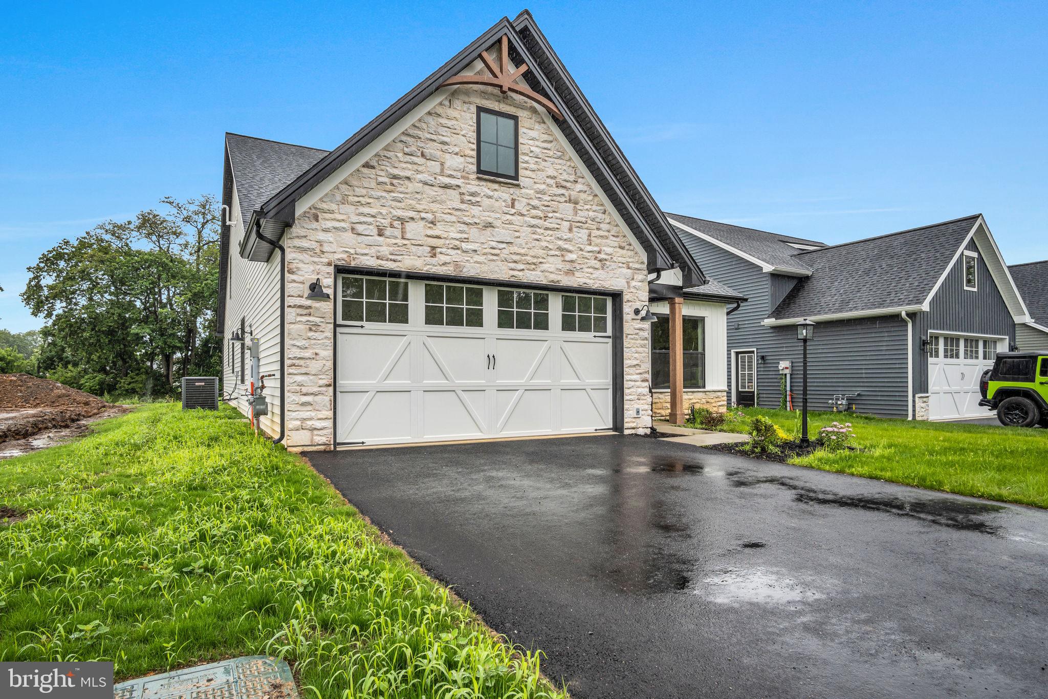 4120 Locust Road Camp Hill, PA 17011 - Photo 2 of 38 a front view of a house with a yard and garage