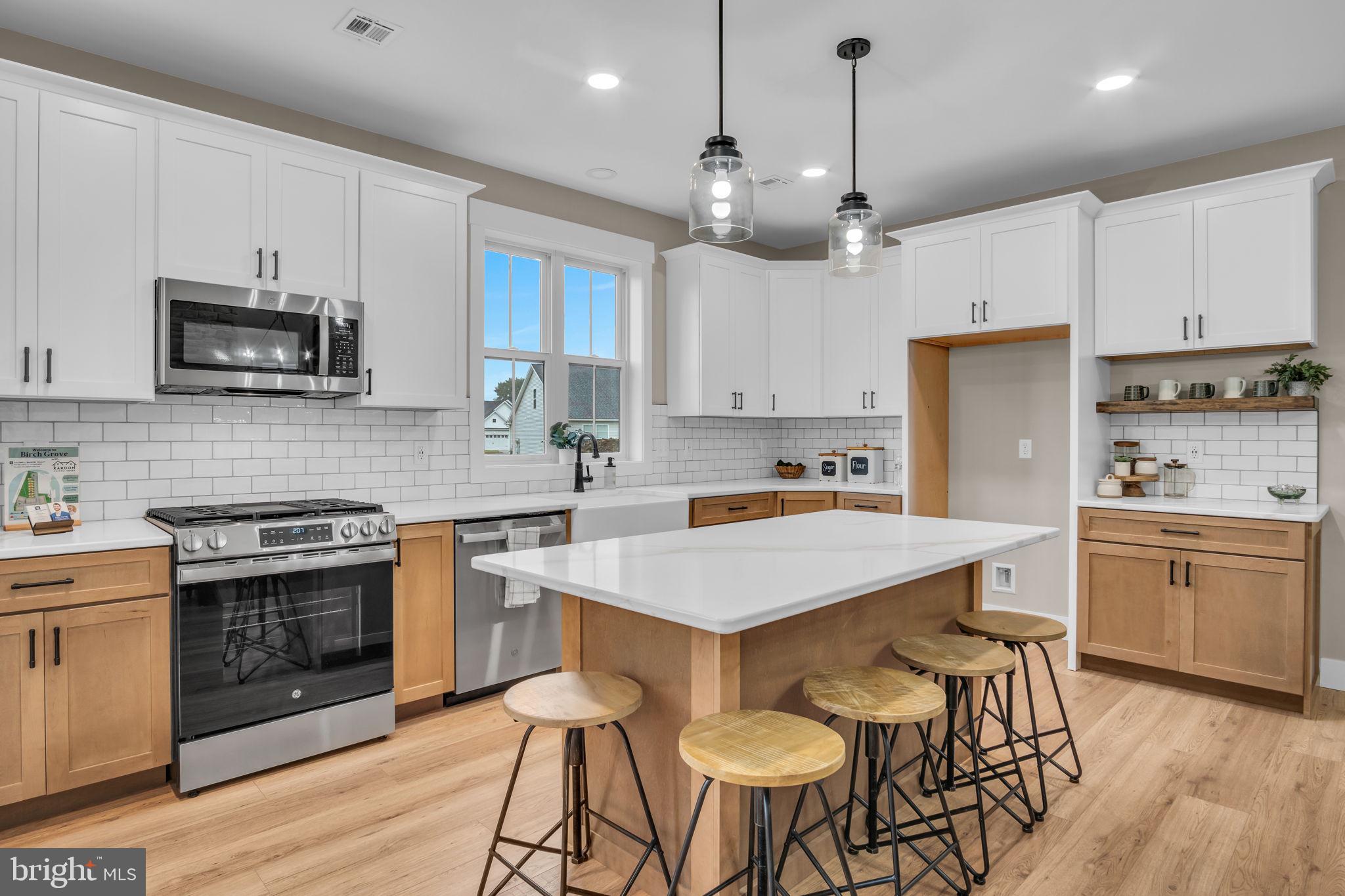 4120 Locust Road Camp Hill, PA 17011 - Photo 23 of 38 a kitchen with cabinets a sink stainless steel appliances and wooden floor
