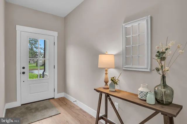 a room with a table and a potted plant