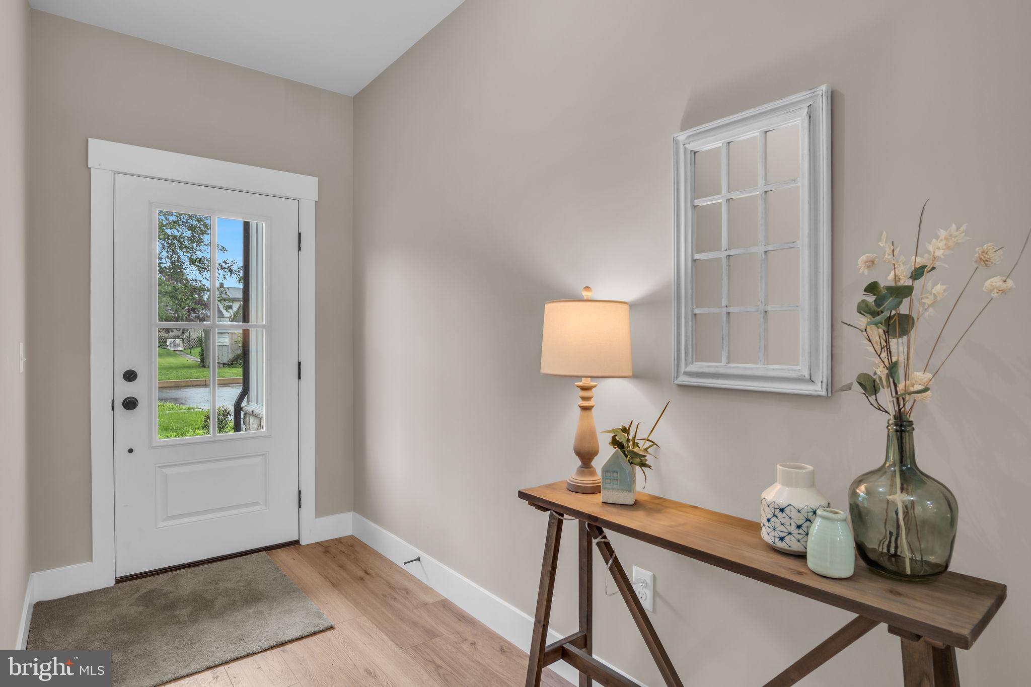 4120 Locust Road Camp Hill, PA 17011 - Photo 7 of 38 a room with a table and a potted plant