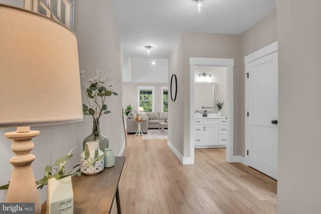 a view of a entryway and livingroom with wooden floor