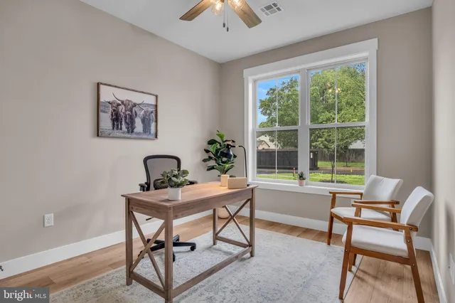 a workspace with furniture and a window