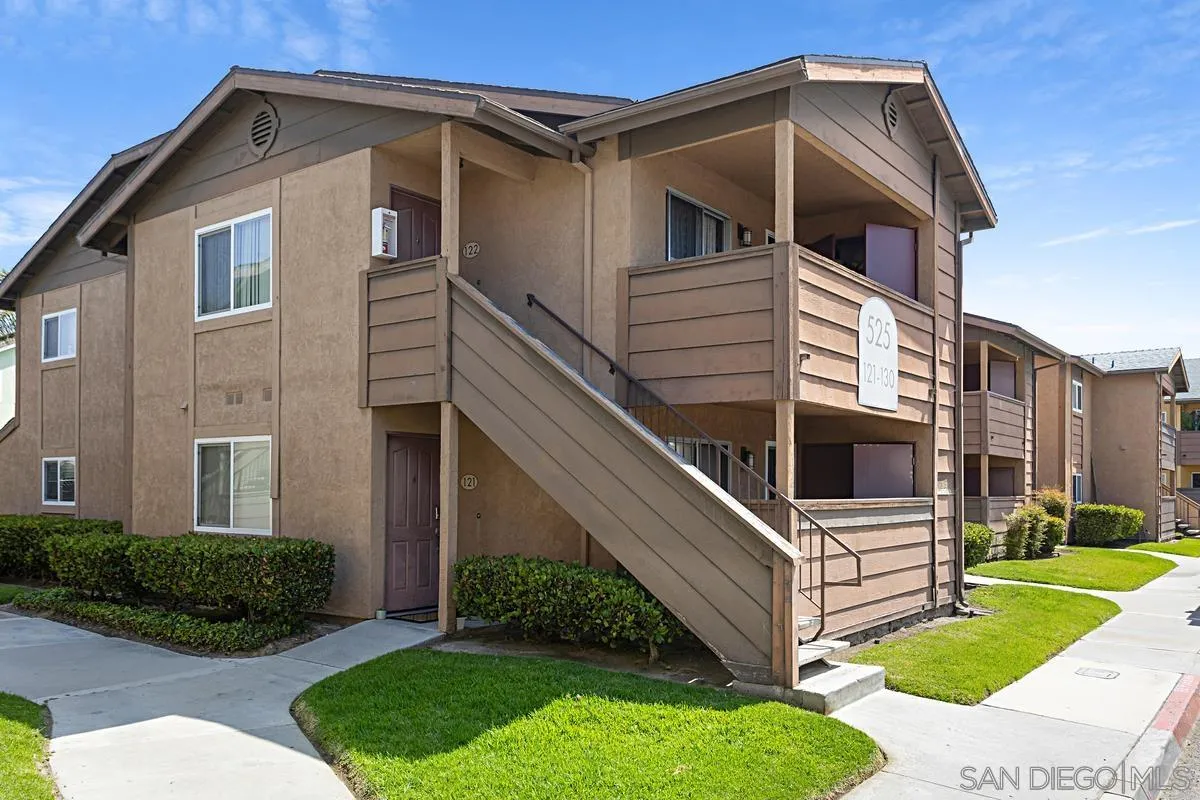 525 Calle Montecito, Unit 124 Oceanside, CA 92057 - Photo 2 of 2 a view of a house with a yard