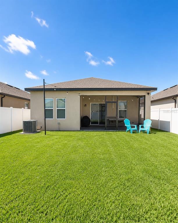 5882 Herder Road St. Cloud, FL 34771 - Photo 13 of 14 a view of a house with backyard and garden