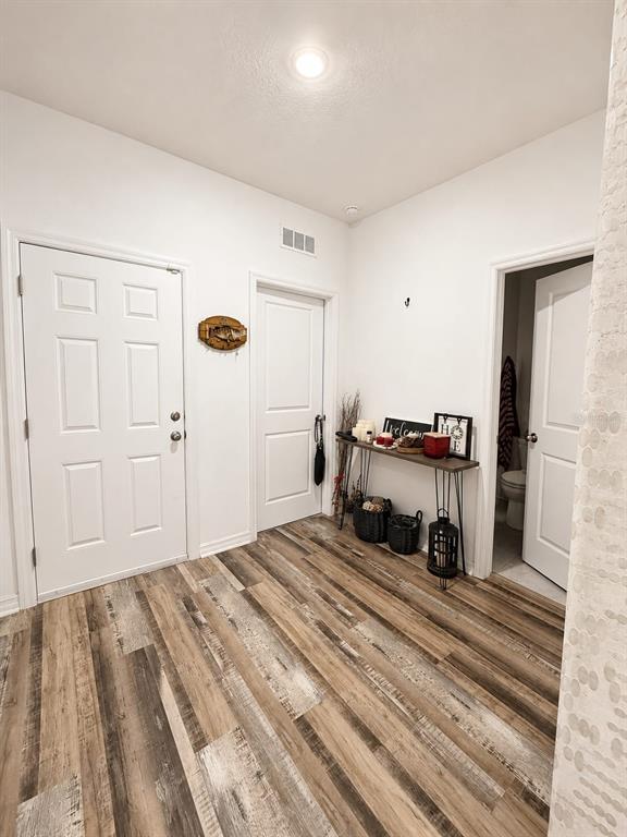 5882 Herder Road St. Cloud, FL 34771 - Photo 2 of 14 a spacious bedroom with a bed and a cabinet