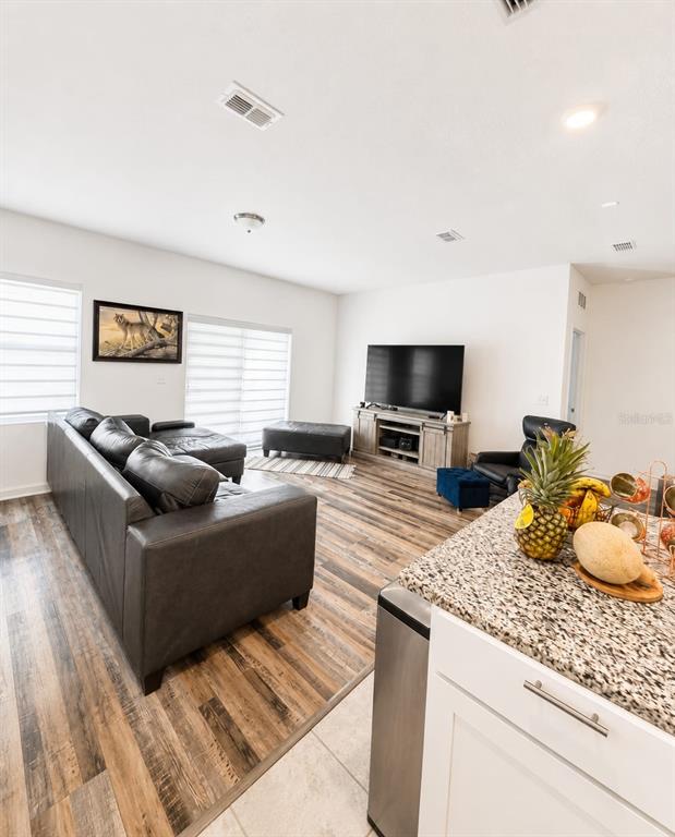 5882 Herder Road St. Cloud, FL 34771 - Photo 3 of 14 a living room with furniture and a flat screen tv