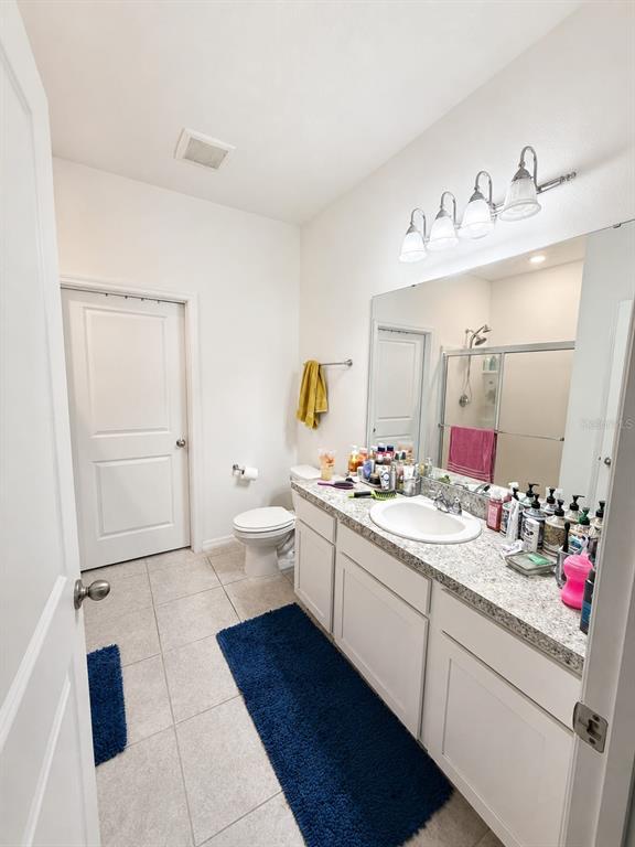 5882 Herder Road St. Cloud, FL 34771 - Photo 8 of 14 a view of bathroom sink and mirror