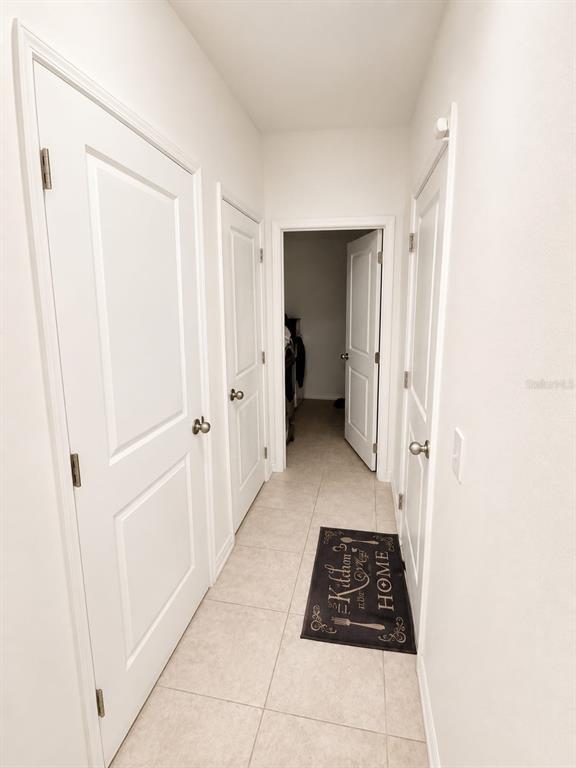 5882 Herder Road St. Cloud, FL 34771 - Photo 9 of 14 a view of a hallway with white walls and a window