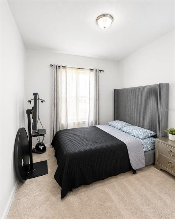 5882 Herder Road St. Cloud, FL 34771 - Photo 10 of 14 a bedroom with a bed and a closet