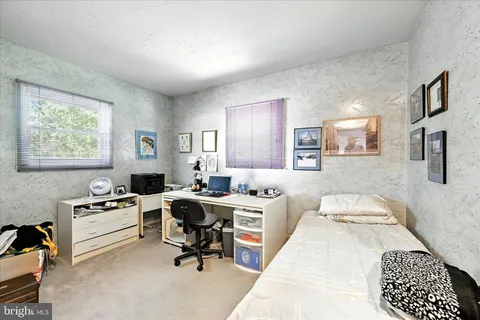 a workspace with furniture and window