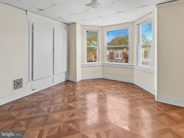 a view of an empty room with a window