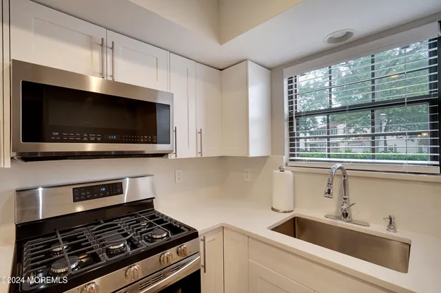 a kitchen with a stove and a microwave