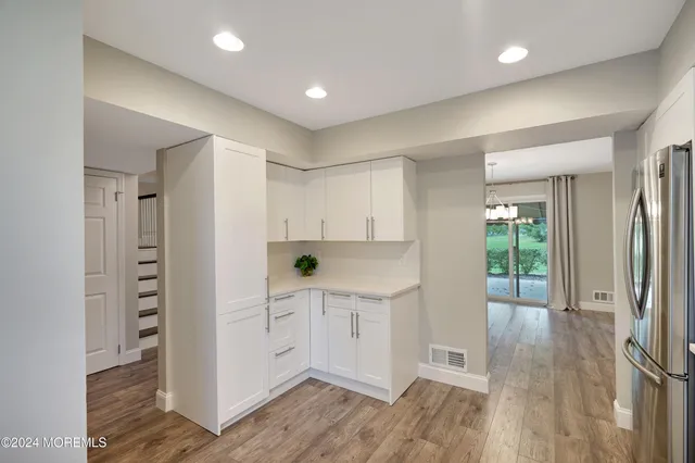 a view of kitchen with wooden floor