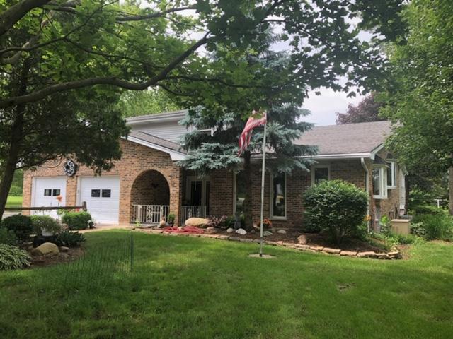 12340 West Offner Road Manhattan, IL 60442 - Photo 1 of 38 a front view of a house with a yard