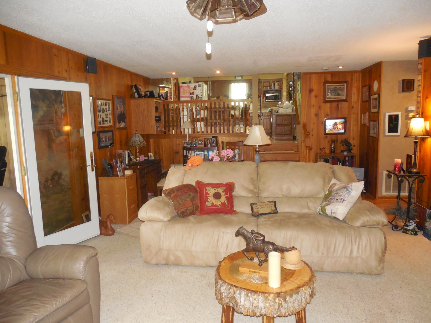12340 West Offner Road Manhattan, IL 60442 - Photo 14 of 38 a living room with furniture and a chandelier