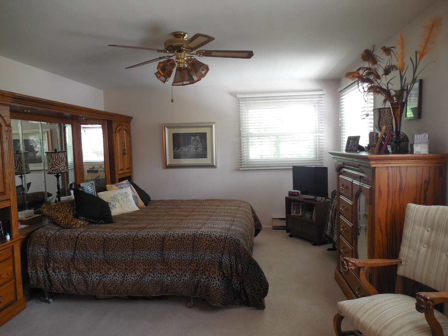 12340 West Offner Road Manhattan, IL 60442 - Photo 21 of 38 a bedroom with a bed and wooden floor